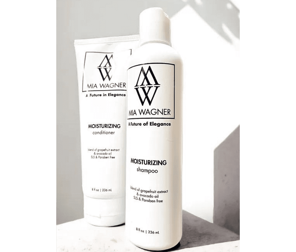 Mia Wagner brand moisturizing shampoo and conditioner bottles.